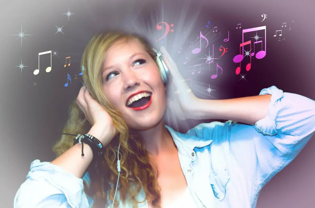 Girl listening to music and singing